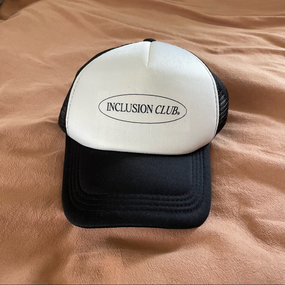 "inclusion club" trucker hat